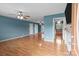 Spacious living room with hardwood floors, ceiling fans, and access to other rooms at 522 Ne Connector Hwy, Albemarle, NC 28001