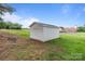Picture of outbuilding on well-maintained lawn, with trees and another building in the background at 522 Ne Connector Hwy, Albemarle, NC 28001
