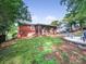 Spacious backyard with brick house and a fire pit at 6401 Montpelier Rd, Charlotte, NC 28210