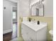 Quaint bathroom with a modern vanity and decorative lighting, featuring access to another room at 6401 Montpelier Rd, Charlotte, NC 28210