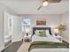 Cozy bedroom with ceiling fan, two windows, and calming decor creating a relaxing space at 6401 Montpelier Rd, Charlotte, NC 28210