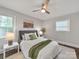 Comfortable bedroom featuring ceiling fan, two windows, and soothing decor for a restful retreat at 6401 Montpelier Rd, Charlotte, NC 28210
