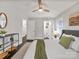 Serene bedroom showcasing calming decor, ceiling fan, and ensuite bathroom for a private space at 6401 Montpelier Rd, Charlotte, NC 28210