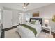Inviting bedroom featuring calming decor, ceiling fan, and ensuite bathroom for added convenience at 6401 Montpelier Rd, Charlotte, NC 28210