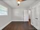 Bedroom showcasing hardwood floors, a ceiling fan, closet, and natural light from the window at 6401 Montpelier Rd, Charlotte, NC 28210