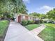 Beautiful brick home featuring an expansive driveway and manicured yard at 6401 Montpelier Rd, Charlotte, NC 28210