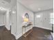 Bright foyer with hardwood floors, modern lighting, and decorative accents at 6401 Montpelier Rd, Charlotte, NC 28210
