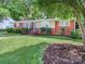 Charming brick home featuring a well-maintained lawn and mature landscaping at 6401 Montpelier Rd, Charlotte, NC 28210