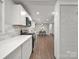 The sleek kitchen and dining area features stainless steel appliances and a modern wall accent at 6401 Montpelier Rd, Charlotte, NC 28210