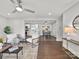 Open-concept living area with hardwood floors, modern lighting, and dining area at 6401 Montpelier Rd, Charlotte, NC 28210
