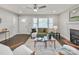 Bright living room featuring a ceiling fan, hardwood floors, and natural light at 6401 Montpelier Rd, Charlotte, NC 28210