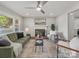Bright living room features a fireplace and modern ceiling fan at 6401 Montpelier Rd, Charlotte, NC 28210