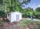 Backyard storage shed next to a landscaped sitting area and fire pit, a great outdoor entertaining space at 6401 Montpelier Rd, Charlotte, NC 28210