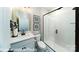 Modern bathroom with a glass-enclosed shower, white vanity, and stylish tile flooring at 7030 Butternut Oak Ter, Huntersville, NC 28078