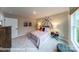 This spacious carpeted bedroom features a basketball theme, neutral colors, and a large window at 7030 Butternut Oak Ter, Huntersville, NC 28078