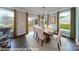 Cozy dining area features natural light, patio access and stylish decor at 7030 Butternut Oak Ter, Huntersville, NC 28078