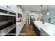 Gourmet kitchen boasts stainless appliances, island and breakfast area in an open layout at 7030 Butternut Oak Ter, Huntersville, NC 28078