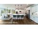Bright open kitchen with large island and stainless steel appliances flowing to breakfast area at 7030 Butternut Oak Ter, Huntersville, NC 28078