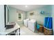 This bright laundry room has modern appliances, a large window, and extra shelving for storage at 7030 Butternut Oak Ter, Huntersville, NC 28078