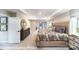 This primary bedroom features a neutral color palette, plush carpeting, and natural light from many windows at 7030 Butternut Oak Ter, Huntersville, NC 28078