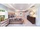This primary bedroom features a neutral color palette, tray ceiling, and an ensuite bathroom entrance at 7030 Butternut Oak Ter, Huntersville, NC 28078
