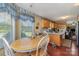 Eat-in kitchen featuring a wood table set, wood cabinets and natural light from a large window at 7785 Crestwood Dr, Kannapolis, NC 28081