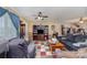 Spacious living room with a ceiling fan, plush seating, and a built-in entertainment center at 7785 Crestwood Dr, Kannapolis, NC 28081