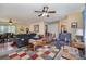 Comfortable living room with a ceiling fan, large sofas, and access to the dining area at 7785 Crestwood Dr, Kannapolis, NC 28081