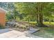 Accessible backyard with a ramp leading to a spacious deck, surrounded by a beautifully landscaped garden at 8101 Truelight Church Rd, Mint Hill, NC 28227