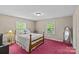 Bright bedroom featuring a large window, wood bed frame and ample natural light at 8101 Truelight Church Rd, Mint Hill, NC 28227