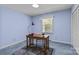 Cozy bedroom with a blue color scheme, a wooden desk, and plenty of natural light at 8101 Truelight Church Rd, Mint Hill, NC 28227