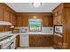 Classic kitchen featuring wood cabinets, white countertops, and modern appliances at 8101 Truelight Church Rd, Mint Hill, NC 28227