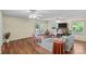 Inviting living room with a cozy fireplace, hardwood floors, and large windows filling the space with sunlight at 8101 Truelight Church Rd, Mint Hill, NC 28227