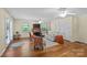 Bright living room featuring a fireplace, hardwood floors, and natural light from multiple windows at 8101 Truelight Church Rd, Mint Hill, NC 28227