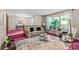 Bright living room featuring large windows, a neutral sofa, and stylish décor at 8101 Truelight Church Rd, Mint Hill, NC 28227
