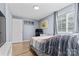 Comfortable bedroom with a large window, closet, and storage at 9606 Vinca Cir # E, Charlotte, NC 28213