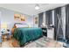 Bright bedroom with modern decor, including a desk, stylish rug, and ceiling fan at 9606 Vinca Cir # E, Charlotte, NC 28213