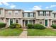 Charming townhome featuring green shutters, a manicured lawn, and inviting front entrances at 9606 Vinca Cir # E, Charlotte, NC 28213