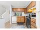 Functional kitchen featuring light wood cabinets, modern appliances, and stylish gray accents at 9606 Vinca Cir # E, Charlotte, NC 28213