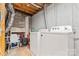 Functional laundry area with washer, dryer, and storage, ready for everyday convenience at 9606 Vinca Cir # E, Charlotte, NC 28213