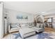 Open concept living room with modern decor, egg chair, and access to the kitchen at 9606 Vinca Cir # E, Charlotte, NC 28213