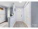 Bright open-concept featuring a breakfast bar with modern stools at 9606 Vinca Cir # E, Charlotte, NC 28213