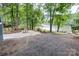 Spacious backyard featuring a patio area, picnic table, and scenic waterfront views at 9763 Pine Tree Ln, Norwood, NC 28128
