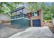 Charming brick home with a covered porch, one-car garage, and a driveway at 9763 Pine Tree Ln, Norwood, NC 28128