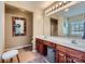 Bathroom with dual sinks, vanity, large mirror, and neutral tones at 10132 Caldwell Depot Rd, Cornelius, NC 28031