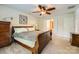 Comfortable bedroom with ceiling fan, neutral carpet, and natural light from the window at 10132 Caldwell Depot Rd, Cornelius, NC 28031