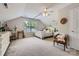 Bright bedroom features a vaulted ceiling, ceiling fan, and natural light at 10132 Caldwell Depot Rd, Cornelius, NC 28031