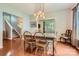 Elegant dining room featuring hardwood floors, stylish lighting and easy access to the kitchen at 10132 Caldwell Depot Rd, Cornelius, NC 28031