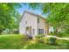 View of the home's exterior with green grass and landscaping at 10132 Caldwell Depot Rd, Cornelius, NC 28031