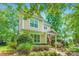 Inviting two-story home with vinyl siding and well-manicured front yard landscape at 10132 Caldwell Depot Rd, Cornelius, NC 28031